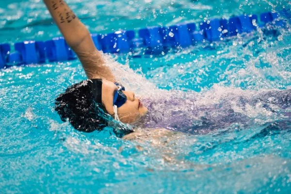 backstroke swimmer in pool